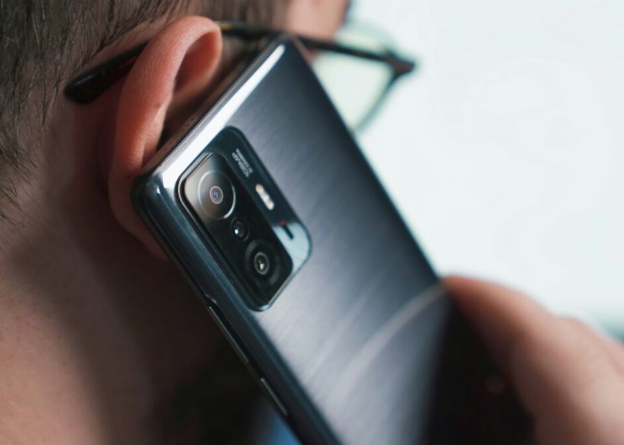 a close up of a person talking on a cell phone