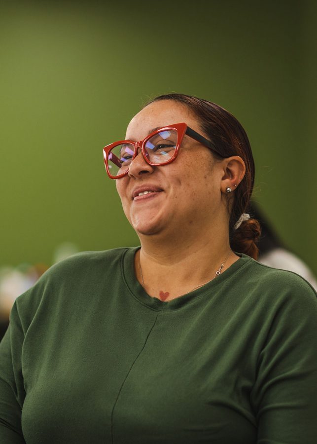 Woman in red glasses smiling