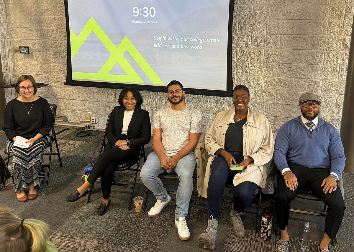 A panel of black speakers at a state college presentation